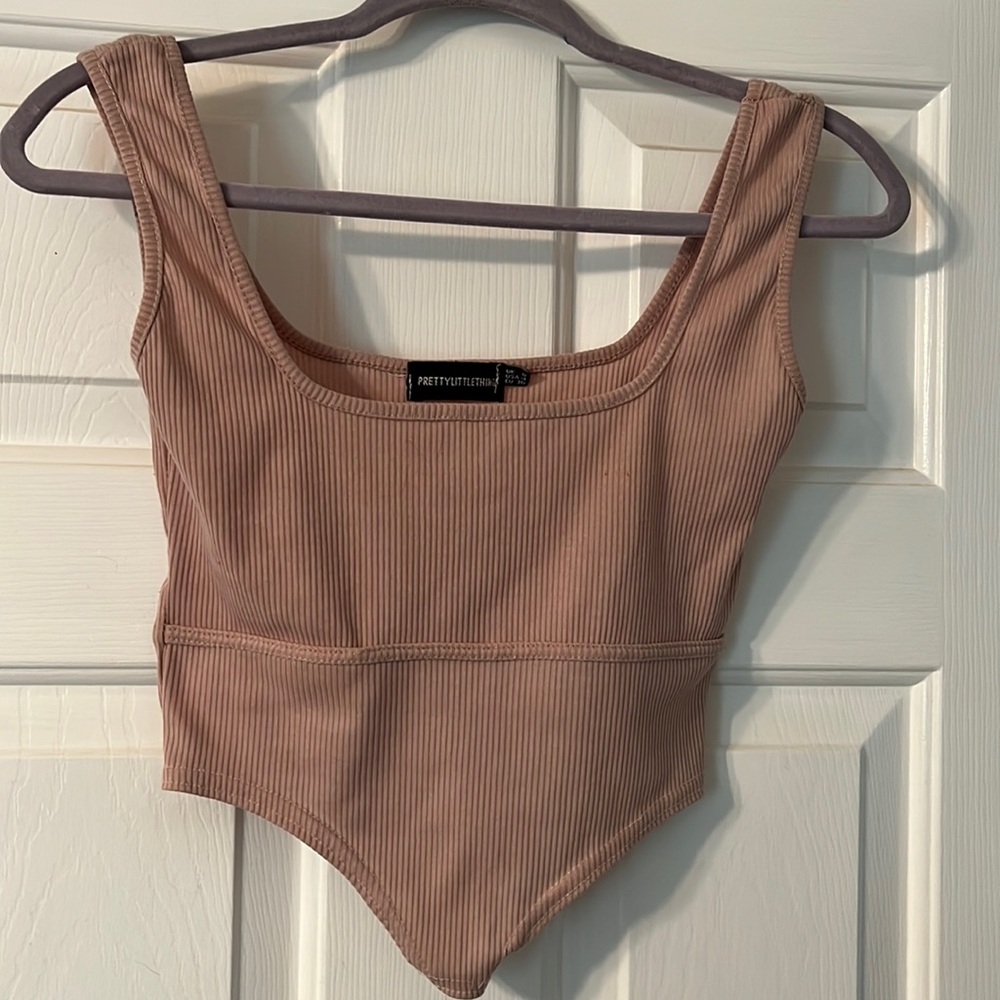 Pink Rib Dip Hem Sleeveless Crop Top PRETTYLITTLETHING